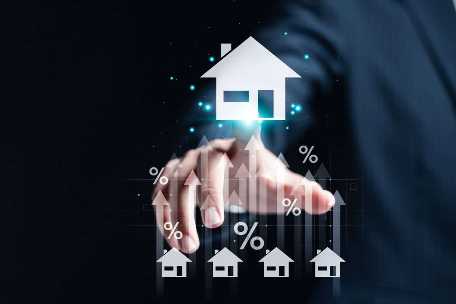 Real estate investment concept. Analyzing mortgage loan home and insurance real property mortgage. interest rate, Investment planning. Person touch house icon with growth graph on virtual screen.