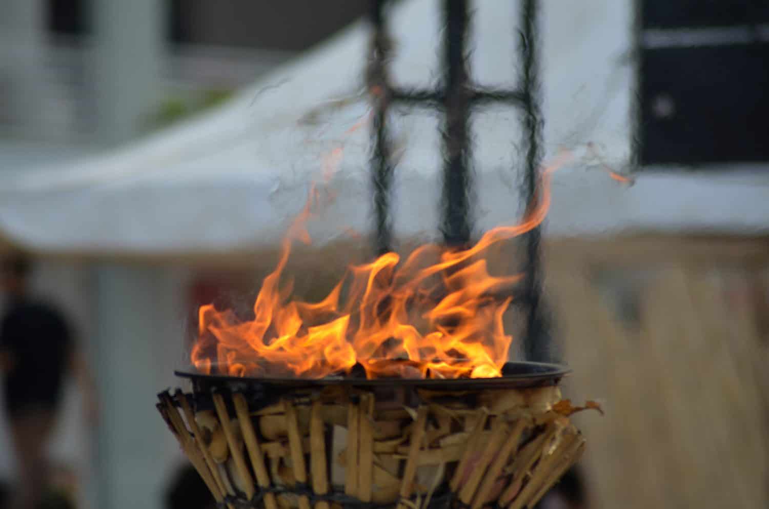 Traditional olympic torches with yellow flames