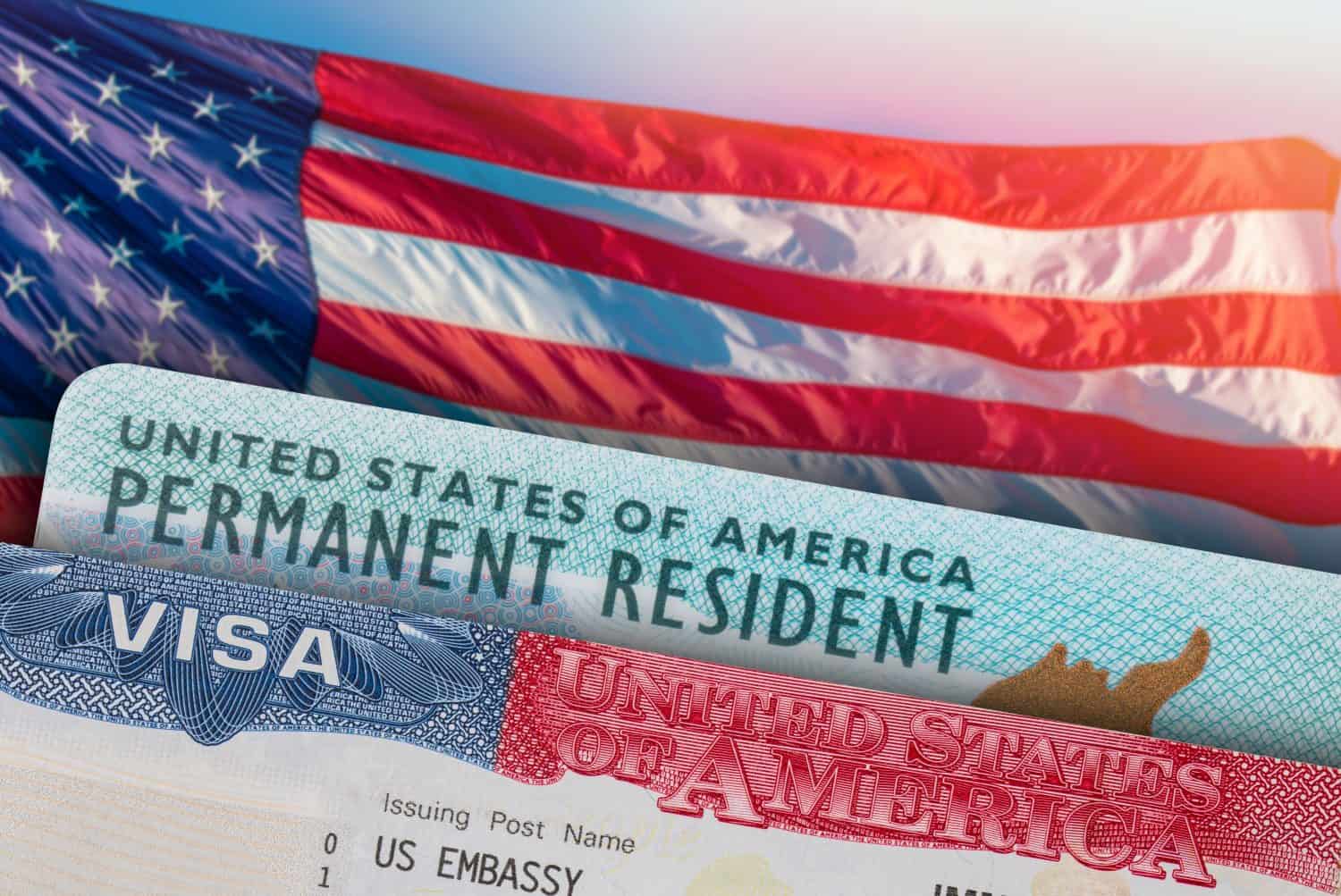 USA VISA and Green Card US Permanent resident. United States of America. Work and Travel ID documents. US Immigrant. Visa for Immigration. Embassy USA. Visa in passport. American flag on background