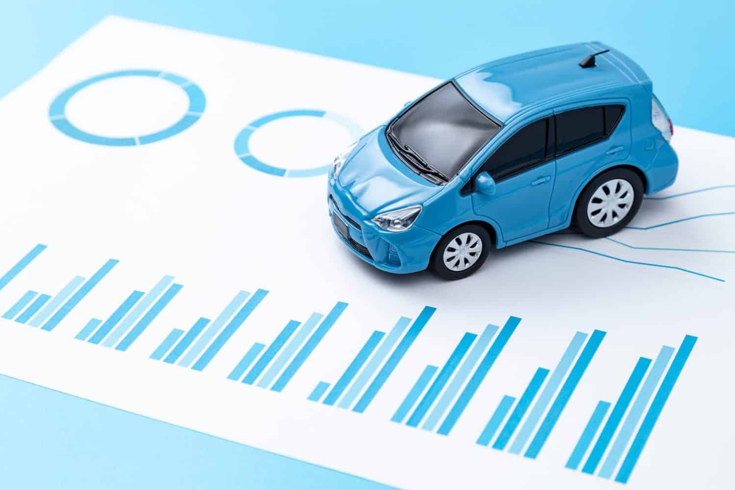 Cars and graphs on a blue background.