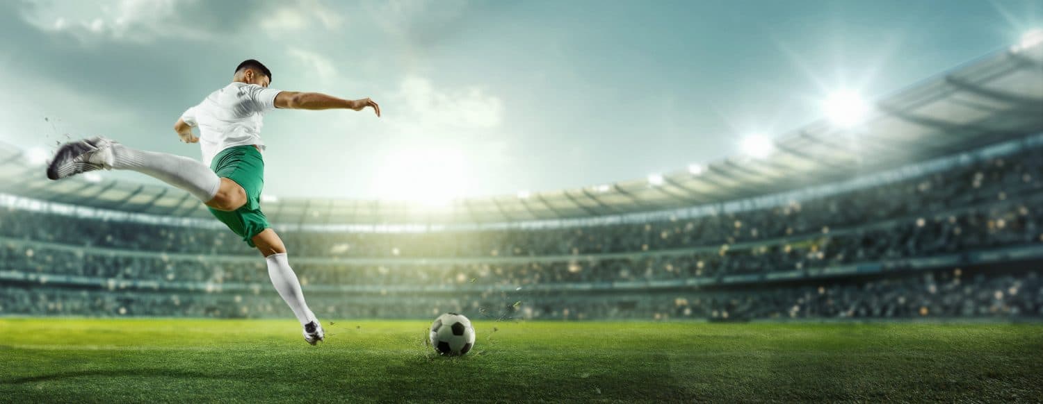 Cinematic image of penalty. Focused on game, running soccer, football player at stadium during decisive, final match. Concept of professional sport, championship, tournament, movement. Ad