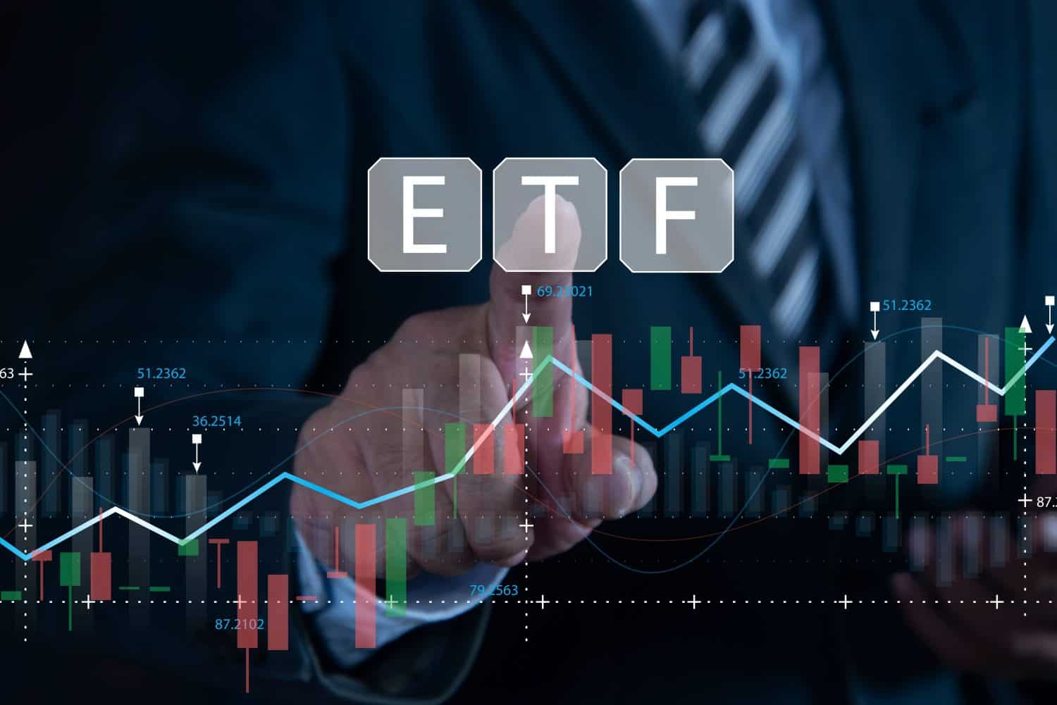 Businessman pointing at ETF (Exchange Traded Funds). Investment Opportunities in Mutual Funds and ETFs, Growing Wealth in the Financial Market.