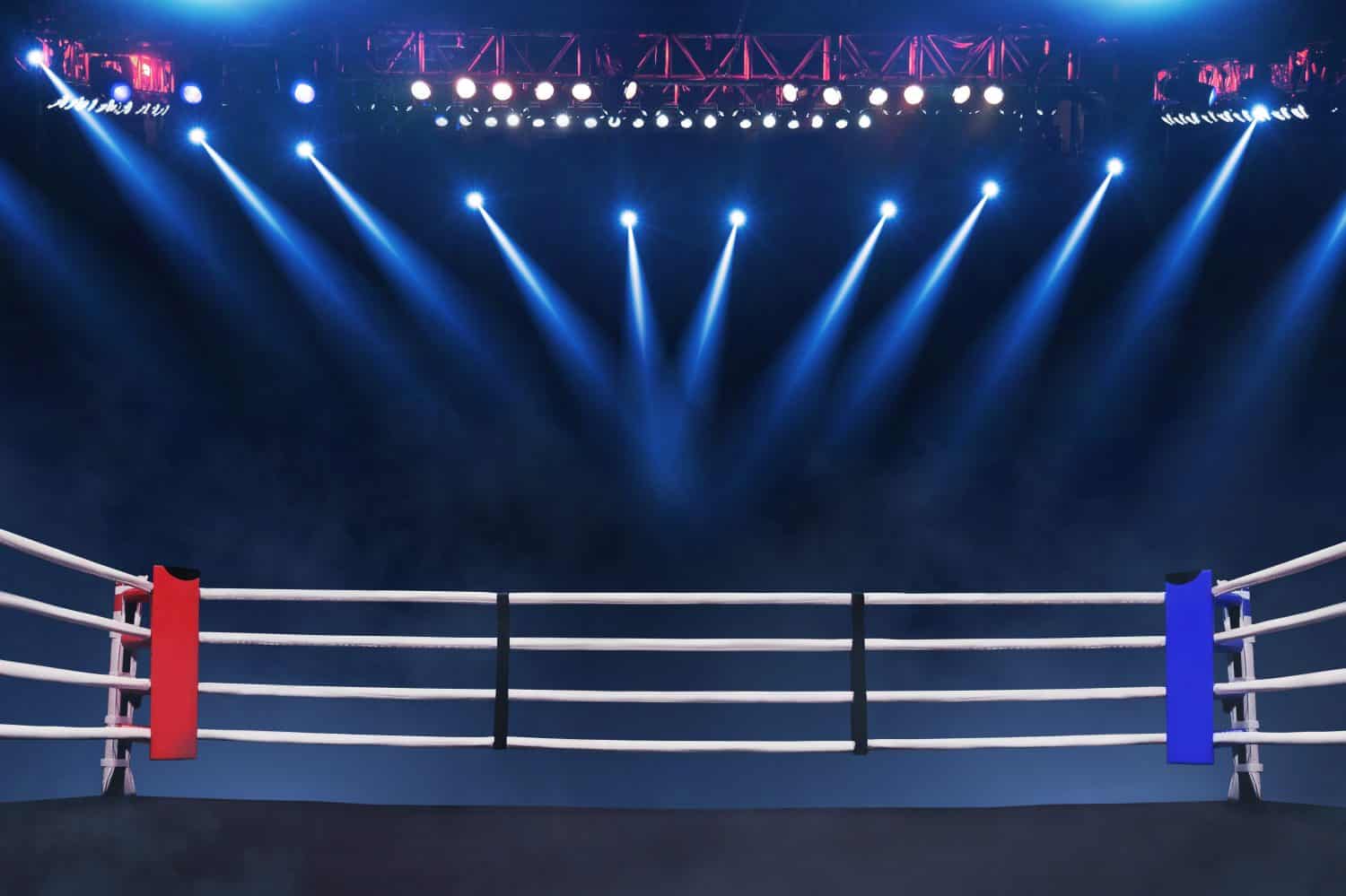 Boxing ring with ropes with blue spotlights and smoke. Boxing tournament for the championship. Boxing Championship. Fight night