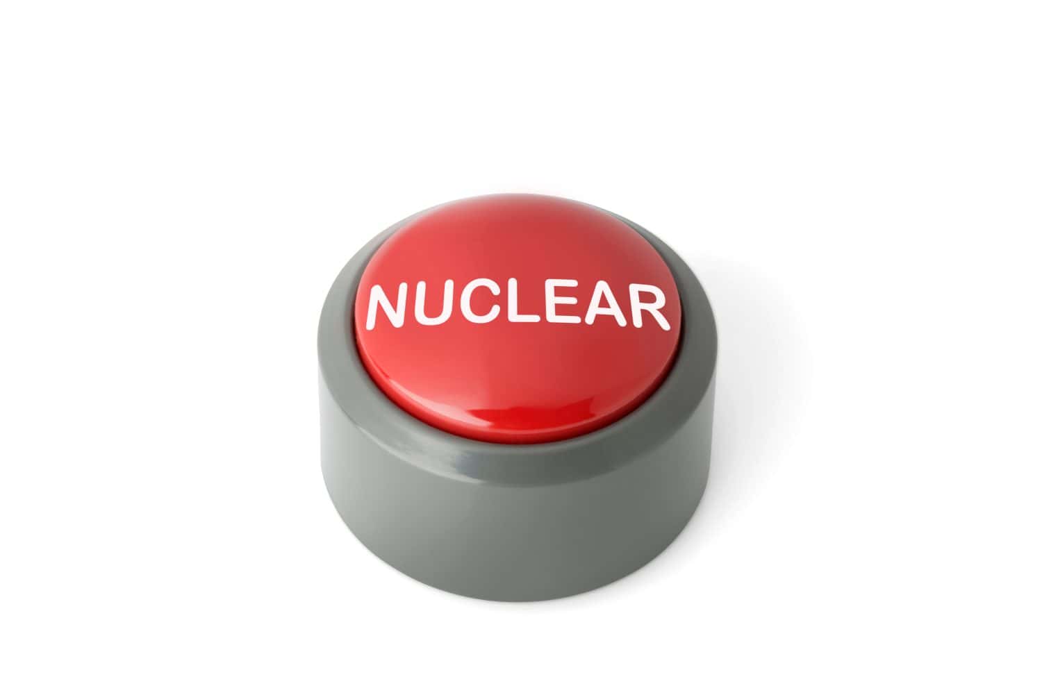 Red circular push button labeled &#039;Nuclear&#039; isolated on white background