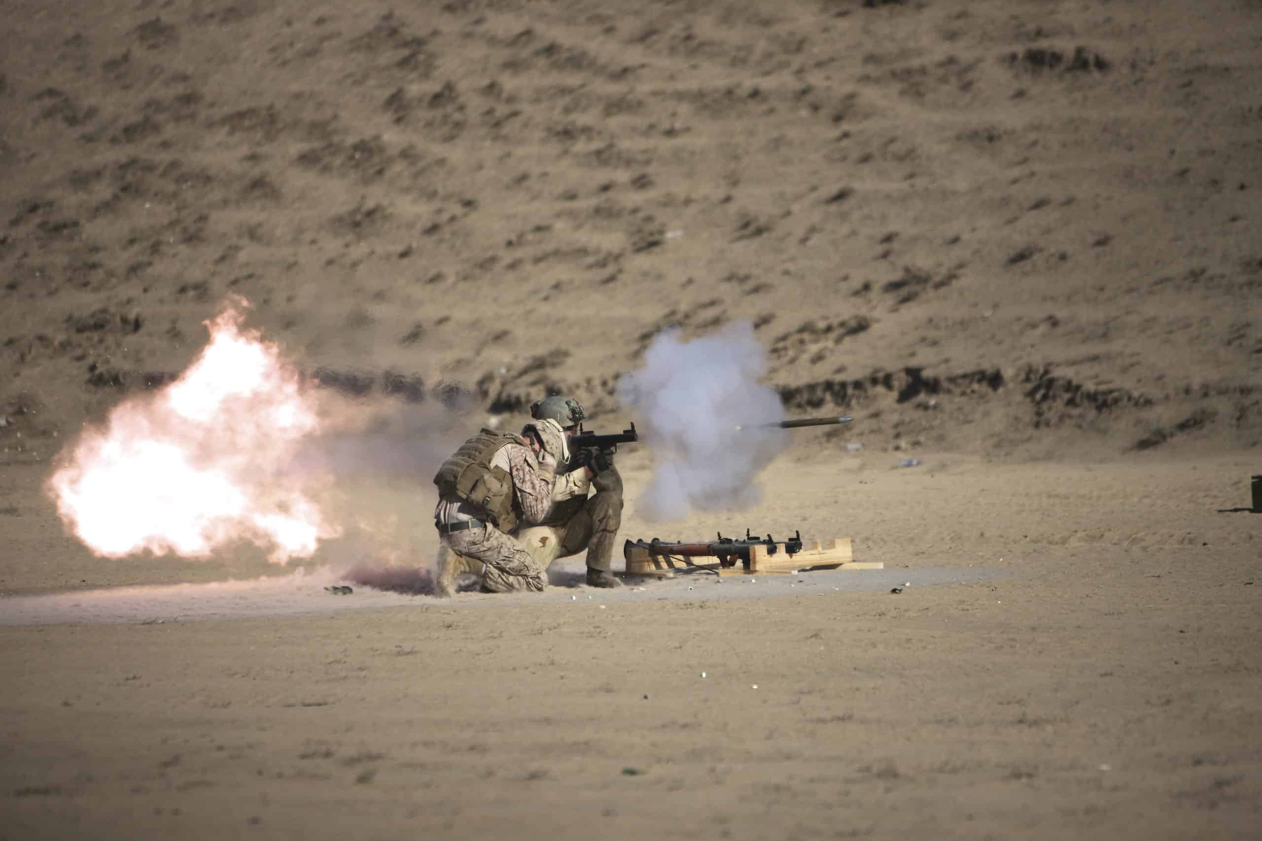 A soldier fires a rocket-propelled grenade launcher.