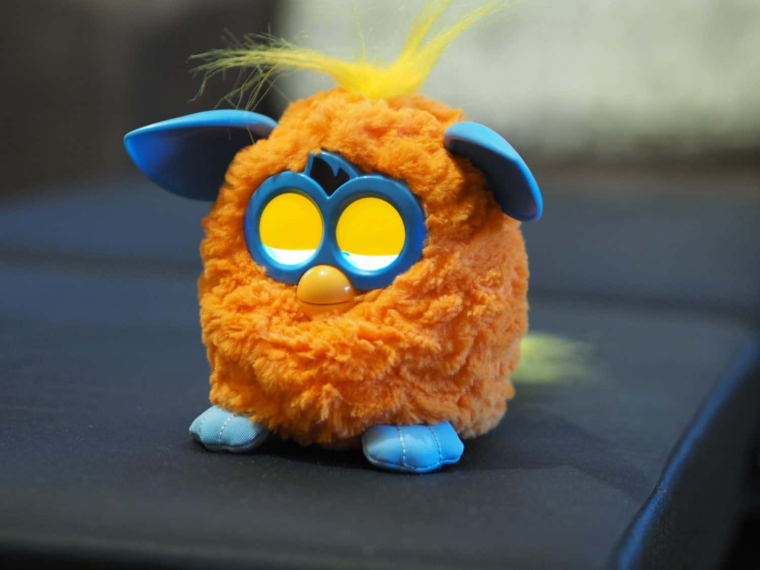 yellow Furby toy with blue ears