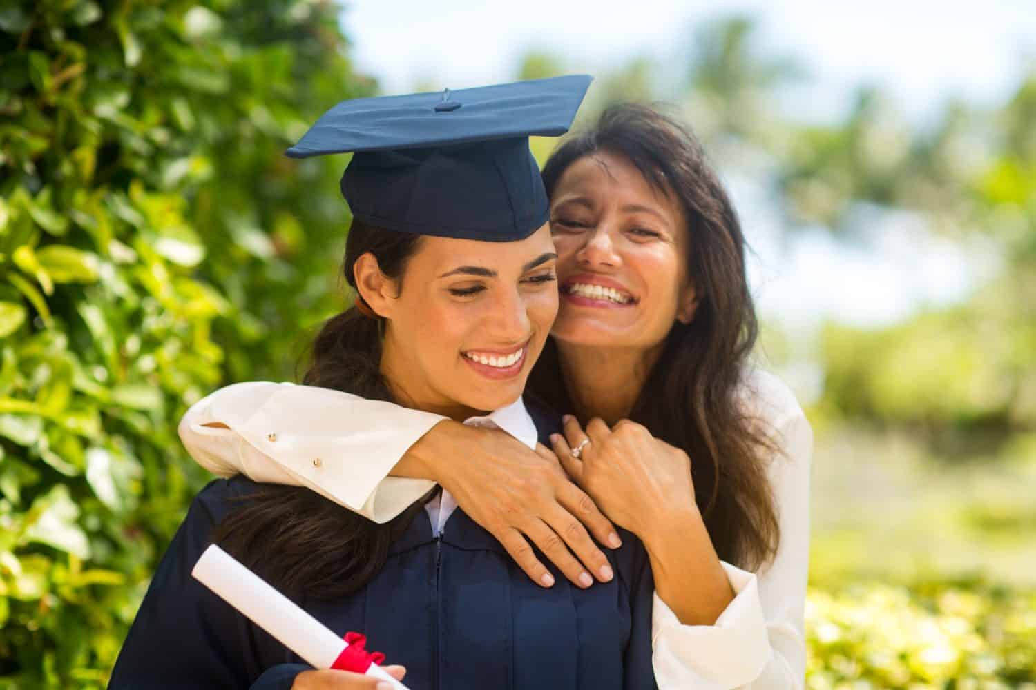 Happy mother celebrating her daughters graduation.
