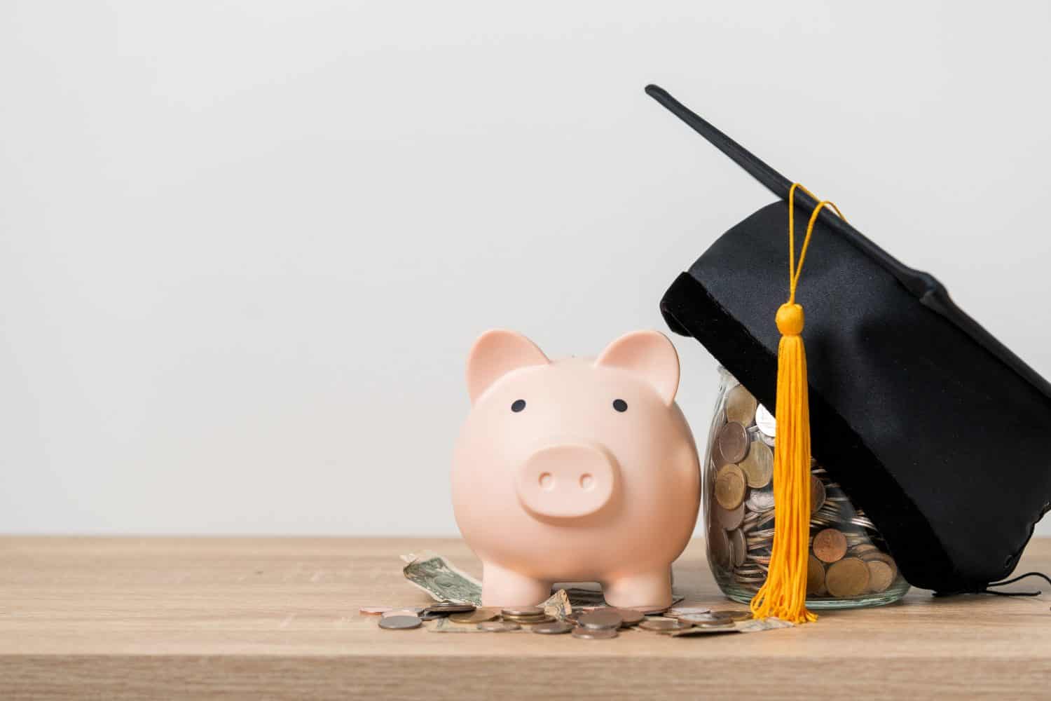 Black graduation hat and piggy bank concept investment in education Graduation save money for education