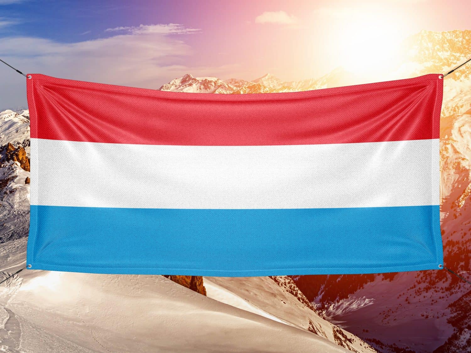 Luxembourg national flag cloth fabric waving on beautiful background.