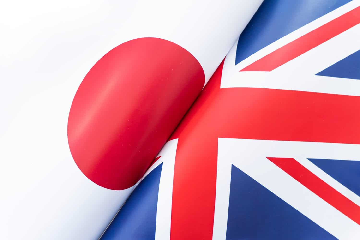 Flags Great Britain and japan. The concept of international relations between countries. The state of governments.