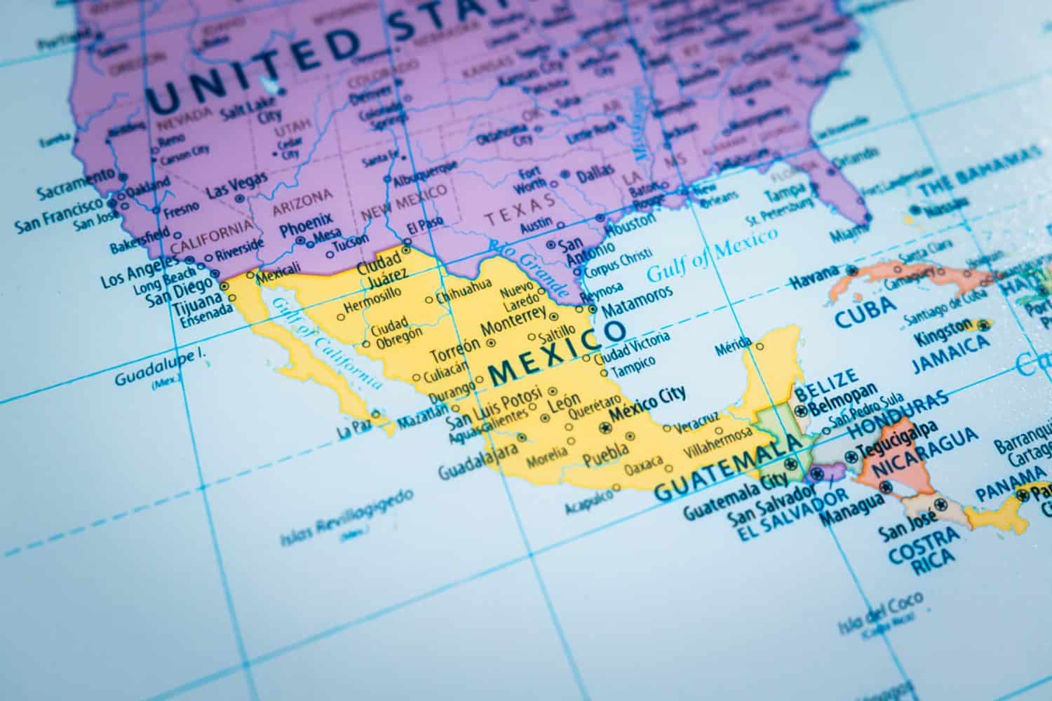 Close-up of the country word Mexico on a world map with the detailed name of the capital city.