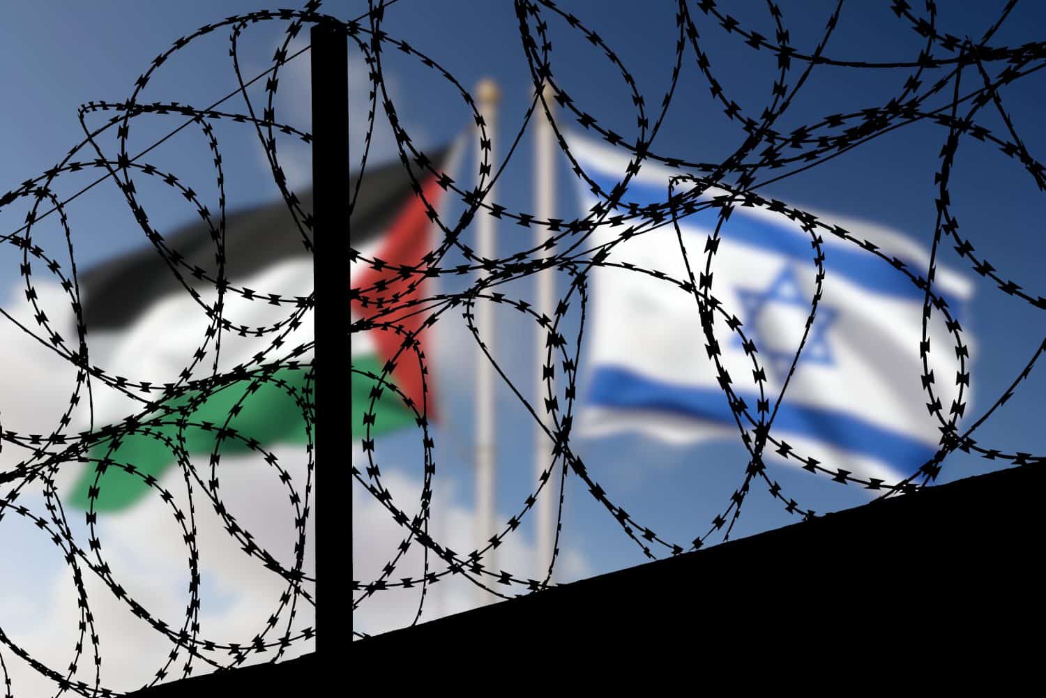 Flags of Israel and Palestine and barbed wire