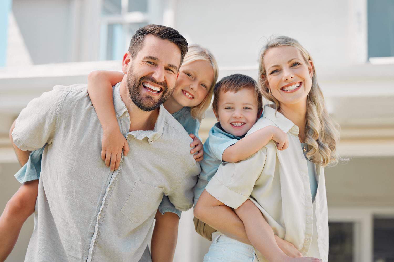 Parents, piggyback and children outdoor in portrait for love, bonding and playful interaction of support at house. Smile, woman and man with kids for family activity in backyard for memory at home