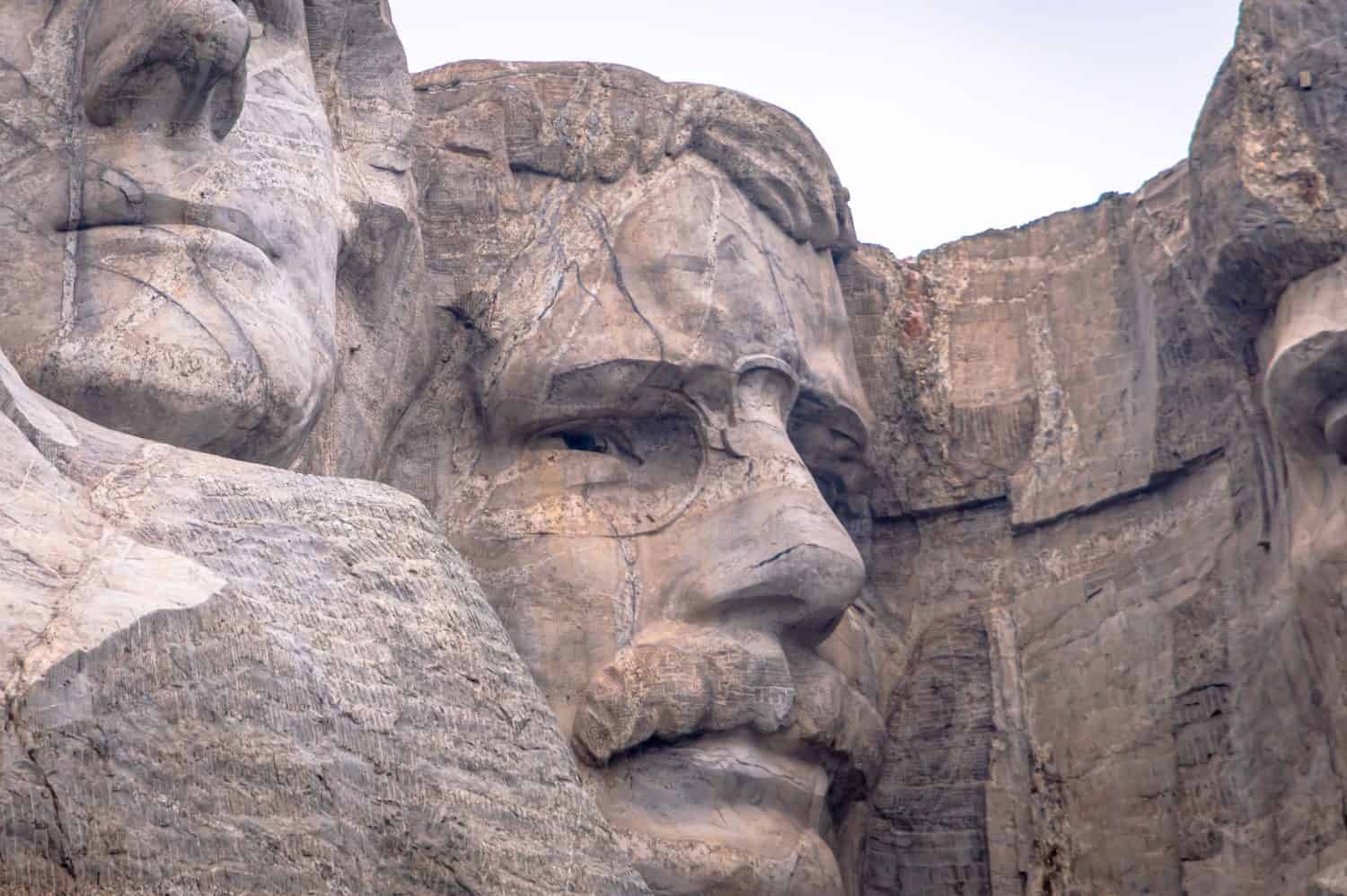 A close up of Theodore Roosevelt, one of four presidential profiles atop Mount Rushmore in South Dakota&#039;s Black Hills