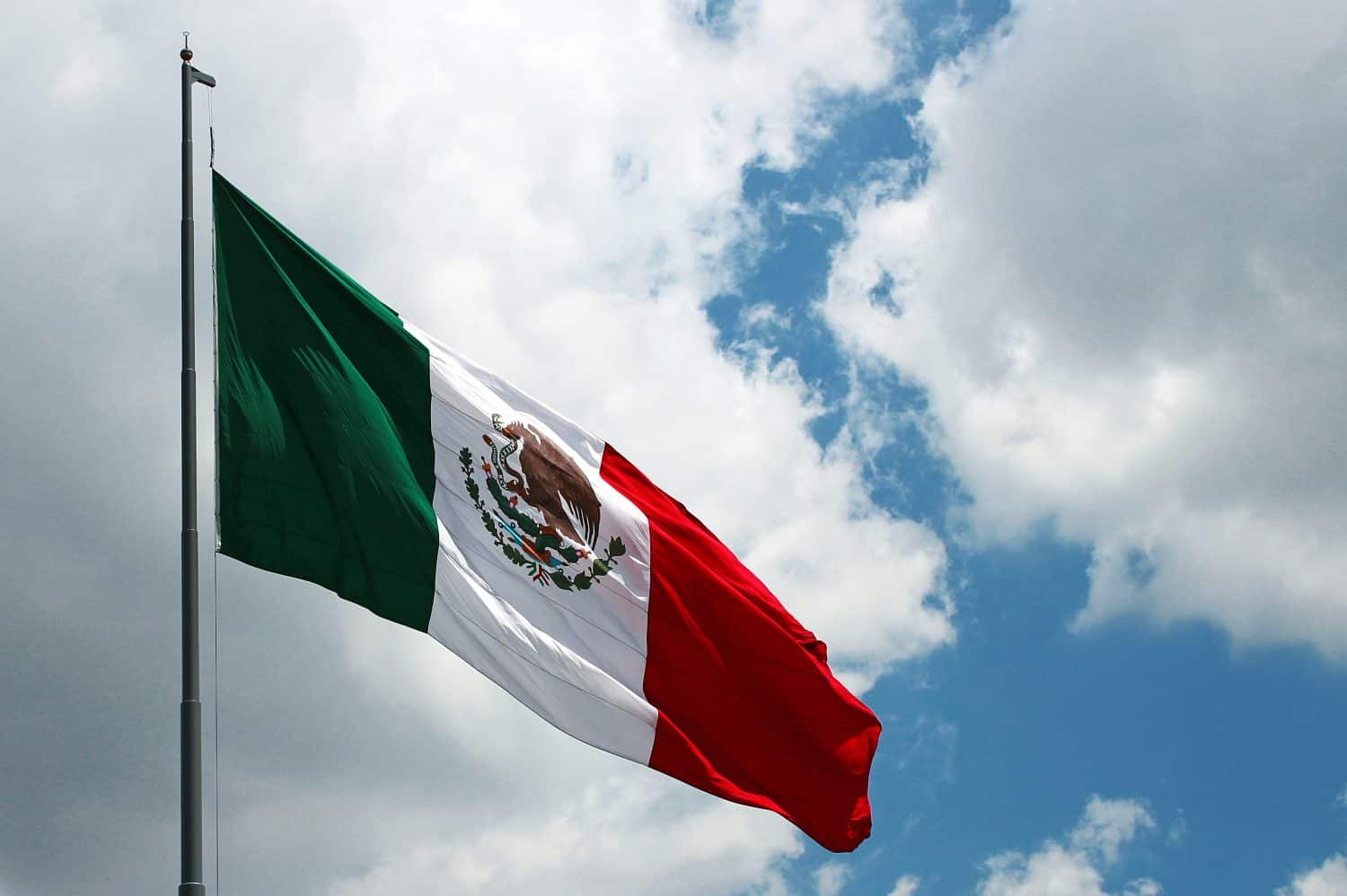 Mexican flag in the air or blue sky