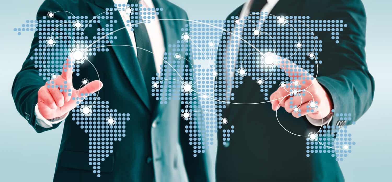 Two businessmen touching world map virtual button. Concepts of information and business contacts interconnected world.