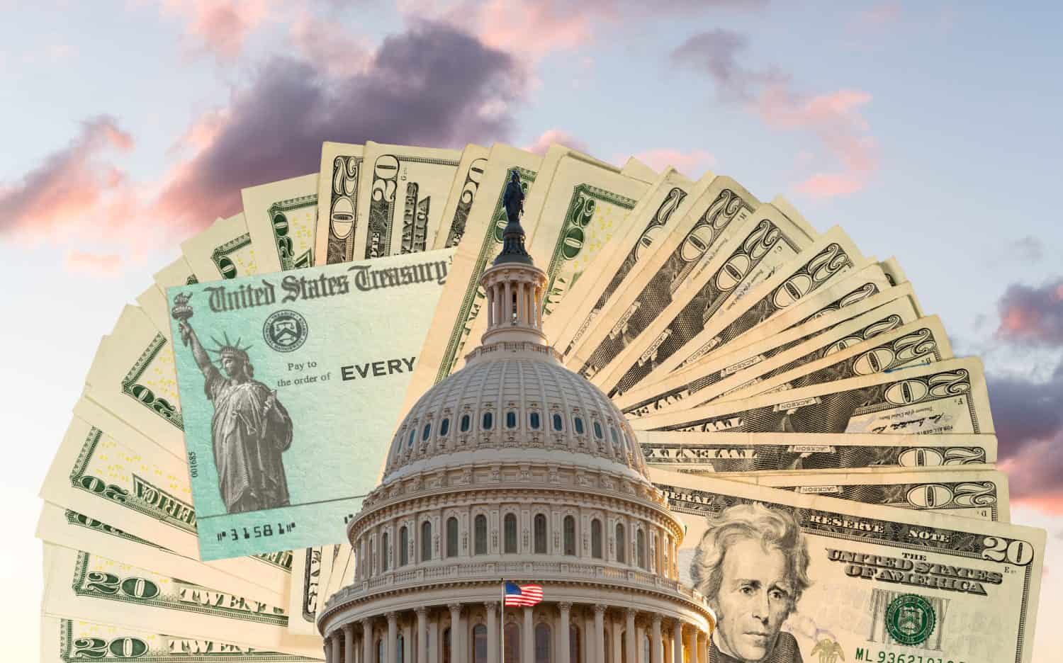 US Congress and Capitol dome in Washington DC with cash and check behind to illustrate coronavirus stimulus payment