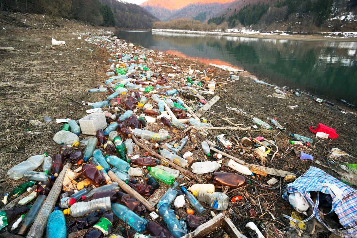 Tourist photographed a panorama of ecological disaster - the river carries plastic rubbish to Europe, abandoned by non-cultural populations. plastic fire releases dangerous chemicals