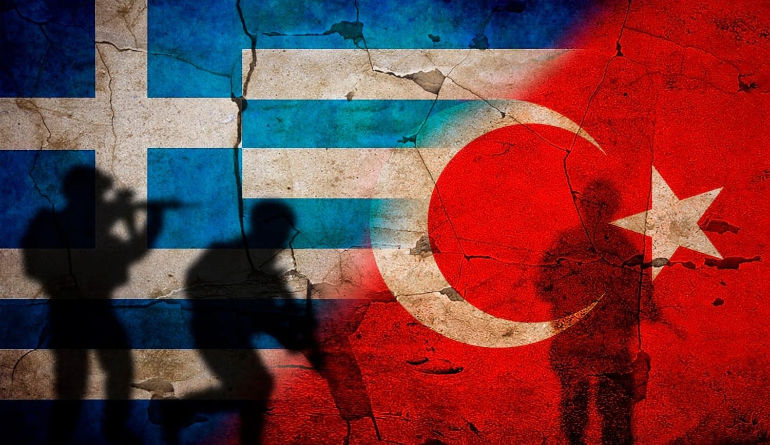 Greece vs. Turkey flag on cracked wall. Concept of war between Turkey and Greece, silhouette of soldiers on the flag of Greece against Turkey. Political conflict between Greece and Turkey