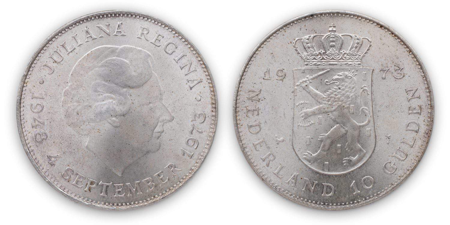 Silver dutch coin Ten Guilder (10 gulden or &#039;Zilveren Tientje&#039;), 1973, shield with lion with arrows and sword, crown on top, Queen Juliana head on obverse. Isolated on white