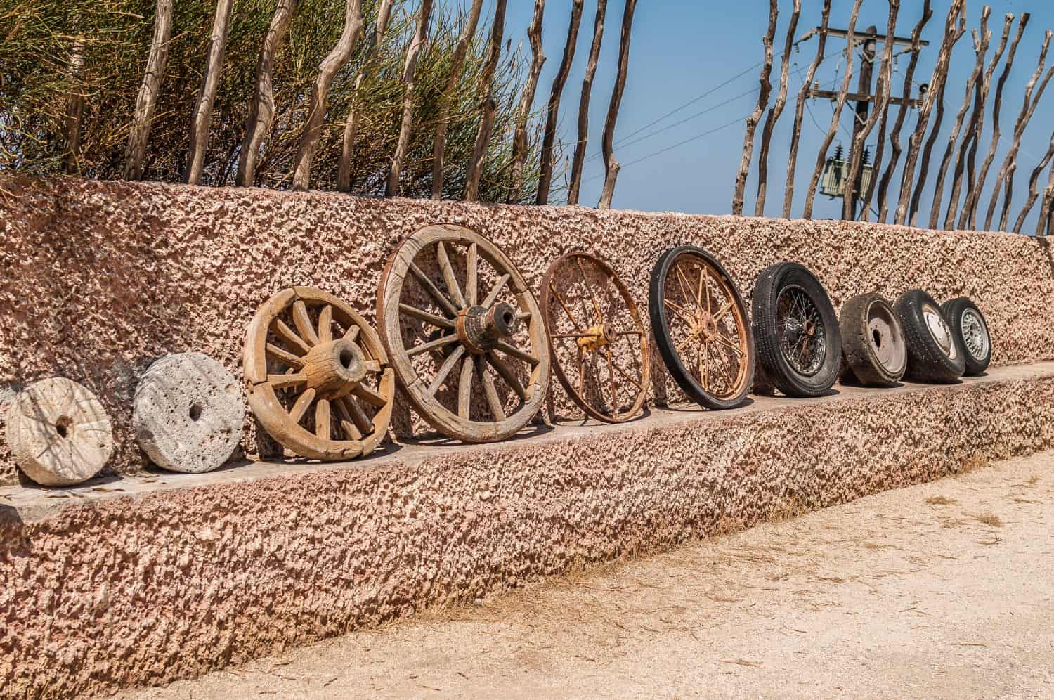 The evolution of the wheel starting from a stone wheel and ending with a steel-belted radial tire.