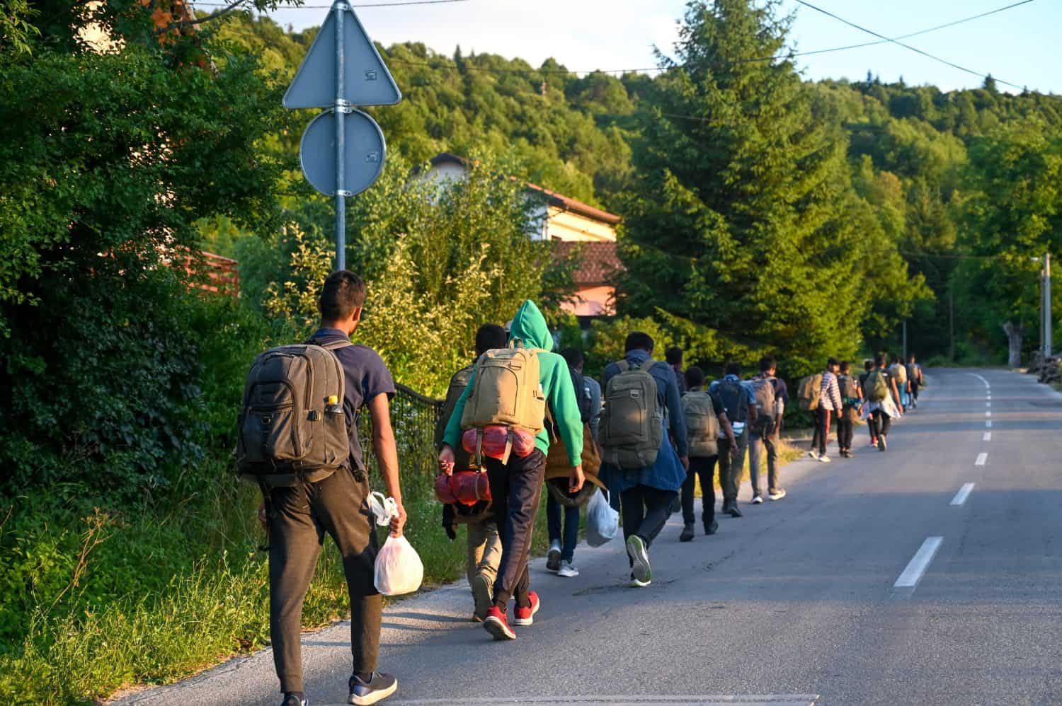 Group of migrants are trying to cross the border. Refugees trying to reach Western Europe. Balkan route.