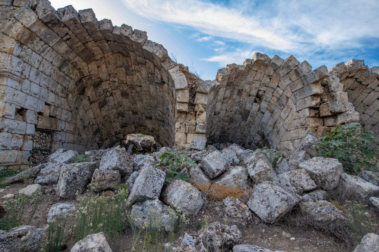 Scenic ruins of the nymphaeum (nymphaion) in Perge (Perga) at Antalya Province, Turkey. Awesome view of the ancient Greek city. Perge is a popular tourist destination in Turkey.