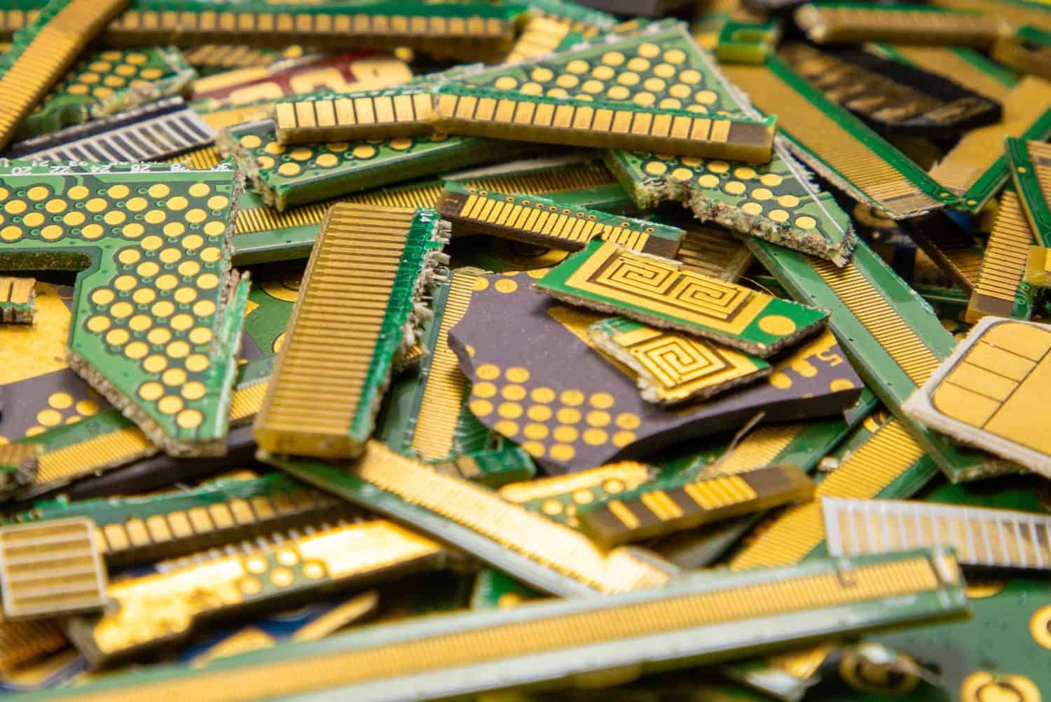 A close-up of industrial electronic waste containing gold for recycling