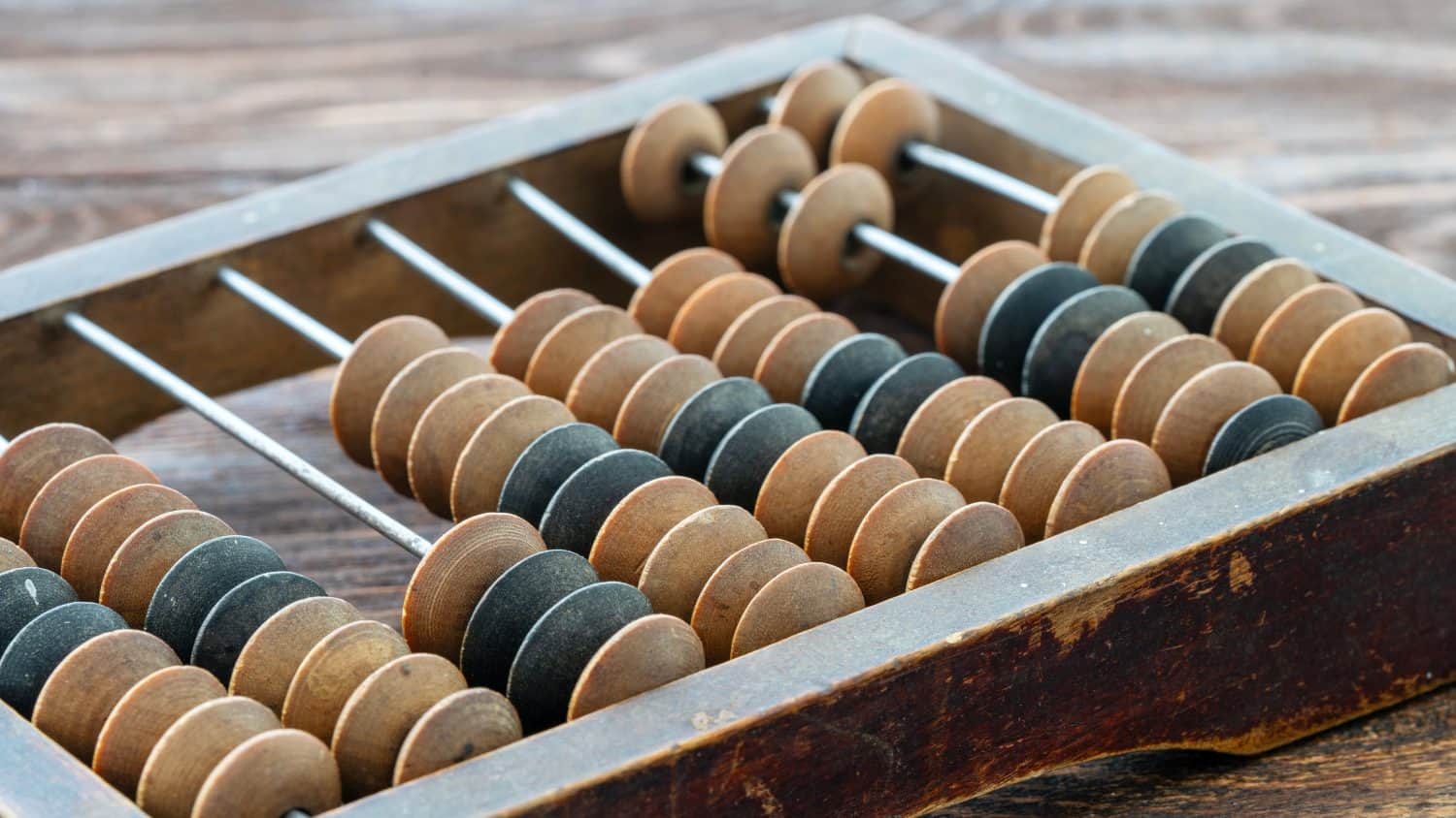 Vintage abacus or abacus on wooden background