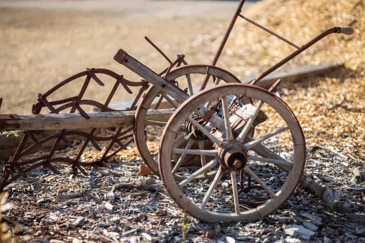 Vintage plow made from wood and steel on the farm ground