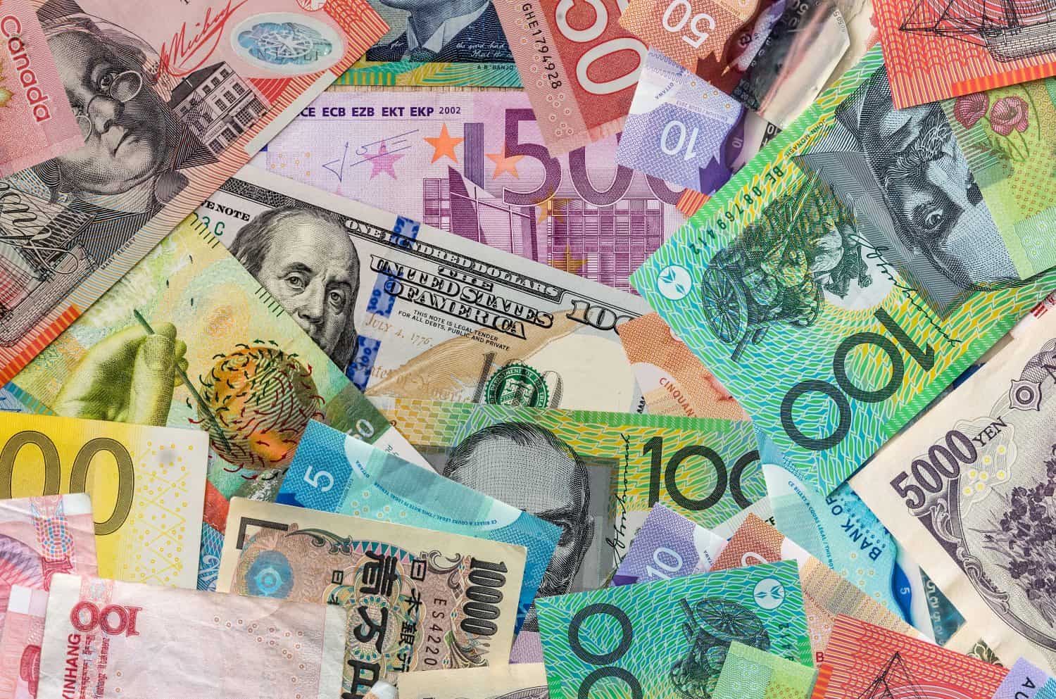 Currencies banknotes as finance background, exchange world money, investment concept