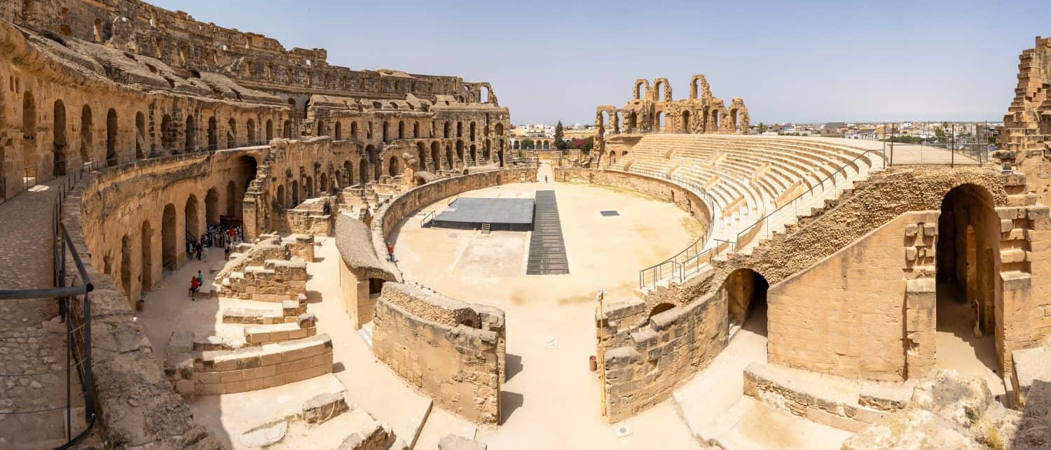 El Jem Colosseum in Tunisia, impressive ruins of massive Roman amphitheater built in 3rd century AD. Well-preserved structure showcases ancient Roman architecture, once hosted gladiatorial contests.