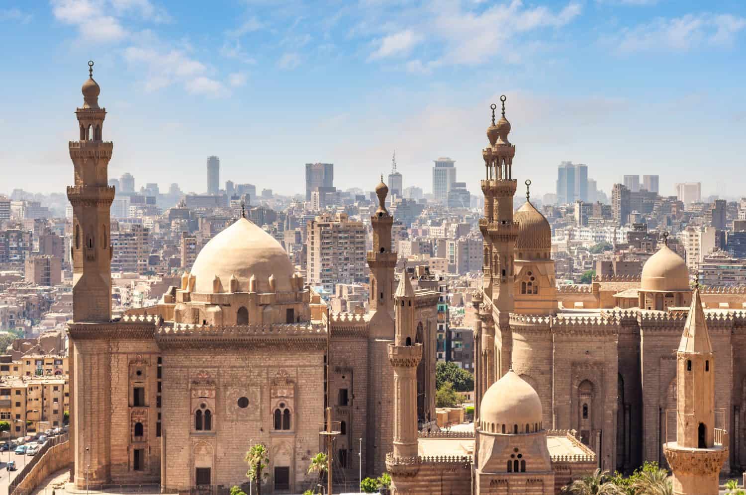 Aerial view of Cairo, Egypt skyline on a hazy day, in front of Mosque Madrasa Sultan Hassan and Al Rifai mosque