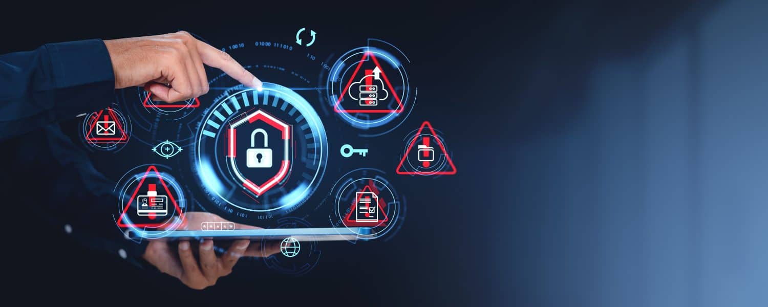 A hand pointing at cybersecurity icons on a virtual interface with a tablet, on a dark background. Concept of cyber security and digital protection