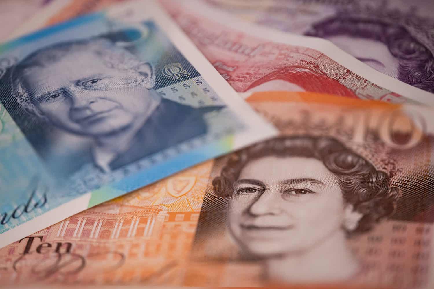 UK banknotes. British Pounds. Currency exchange concept. Money background. Selective focus. Flat lay.