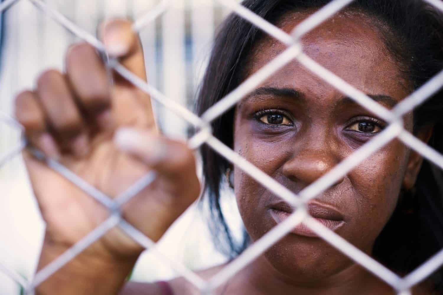 Social issues, abuse and violence on women. Depressed girl, sad african american young woman crying at home. Abused and scared wife