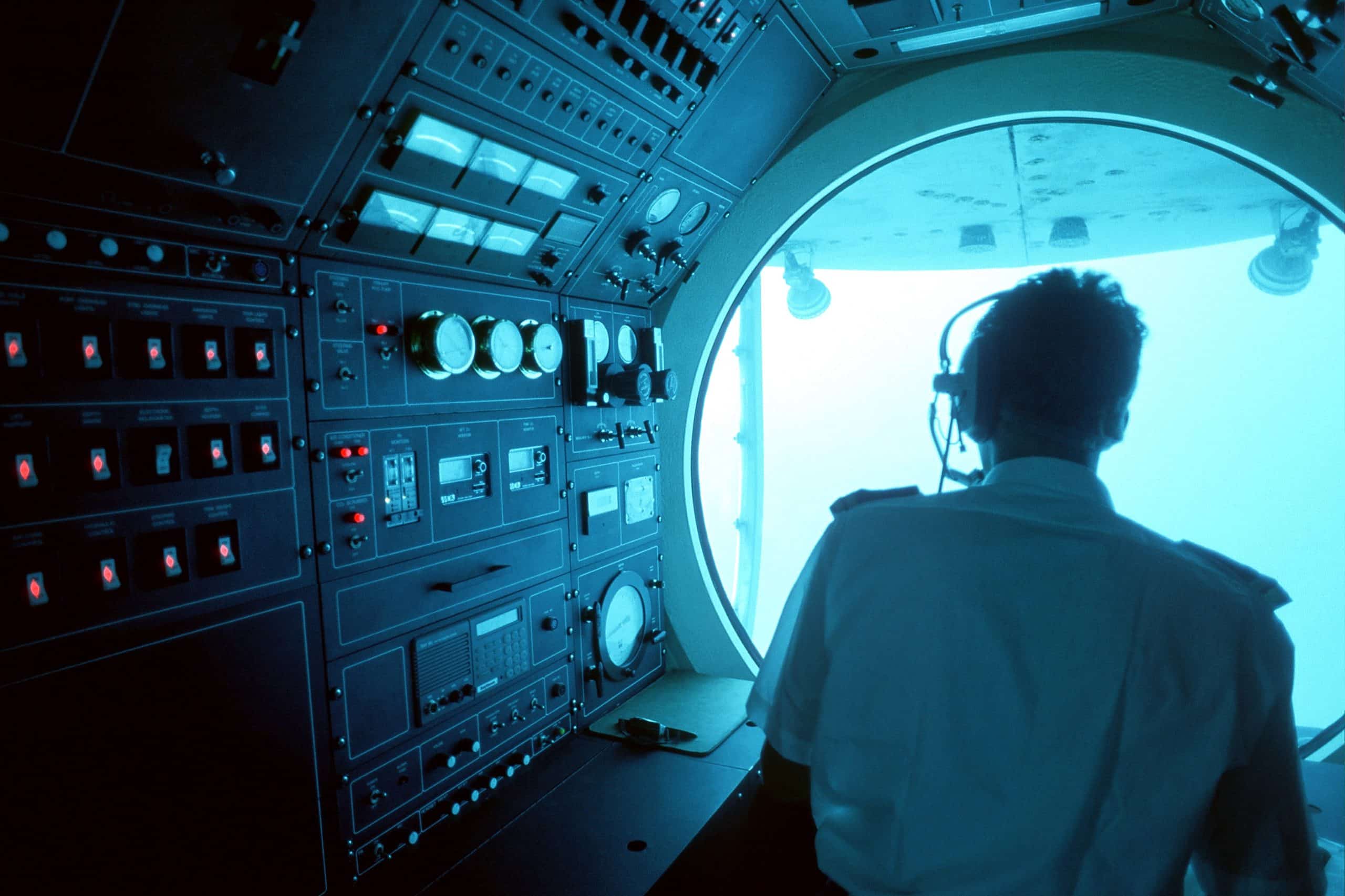 Man navigating submarine