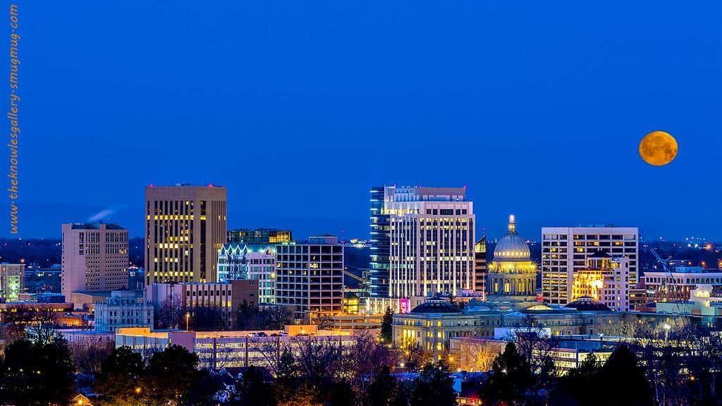 Blue night sky over Boise Idaho with moon by Knowles Gallery