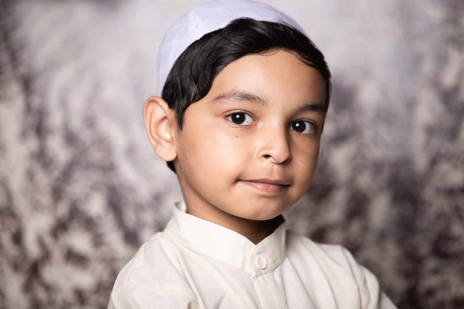 Muslim Child Portrait Looking Towards to Camera and Giving Expression