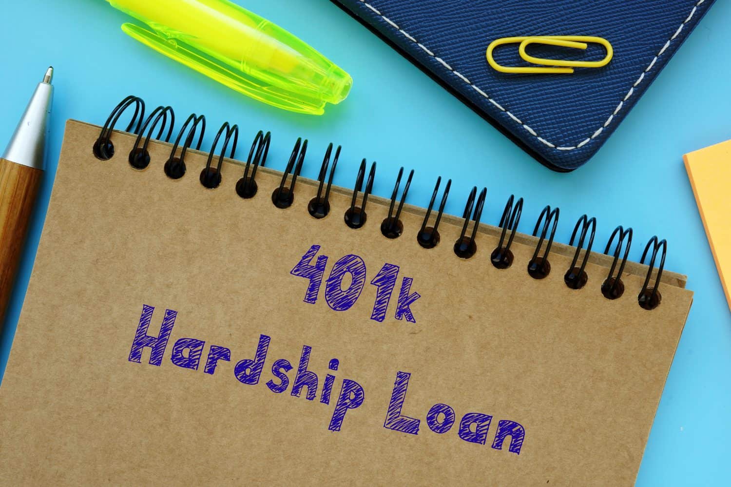 Financial concept about 401k Hardship Loan with phrase on the sheet.