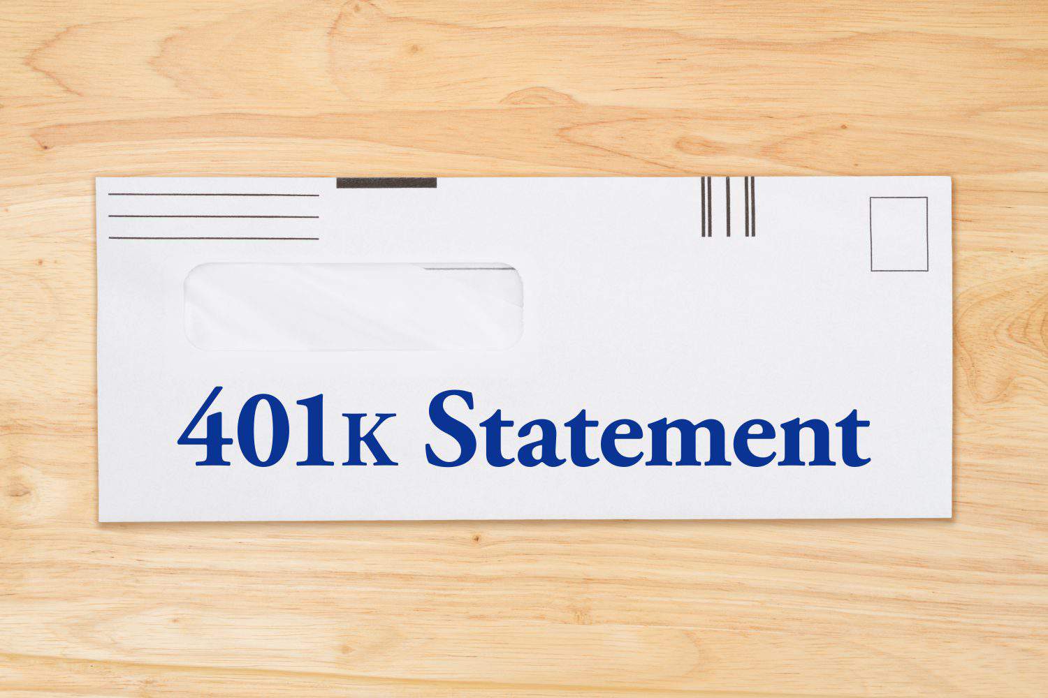 401k statement message on mailing envelope on a wood desk