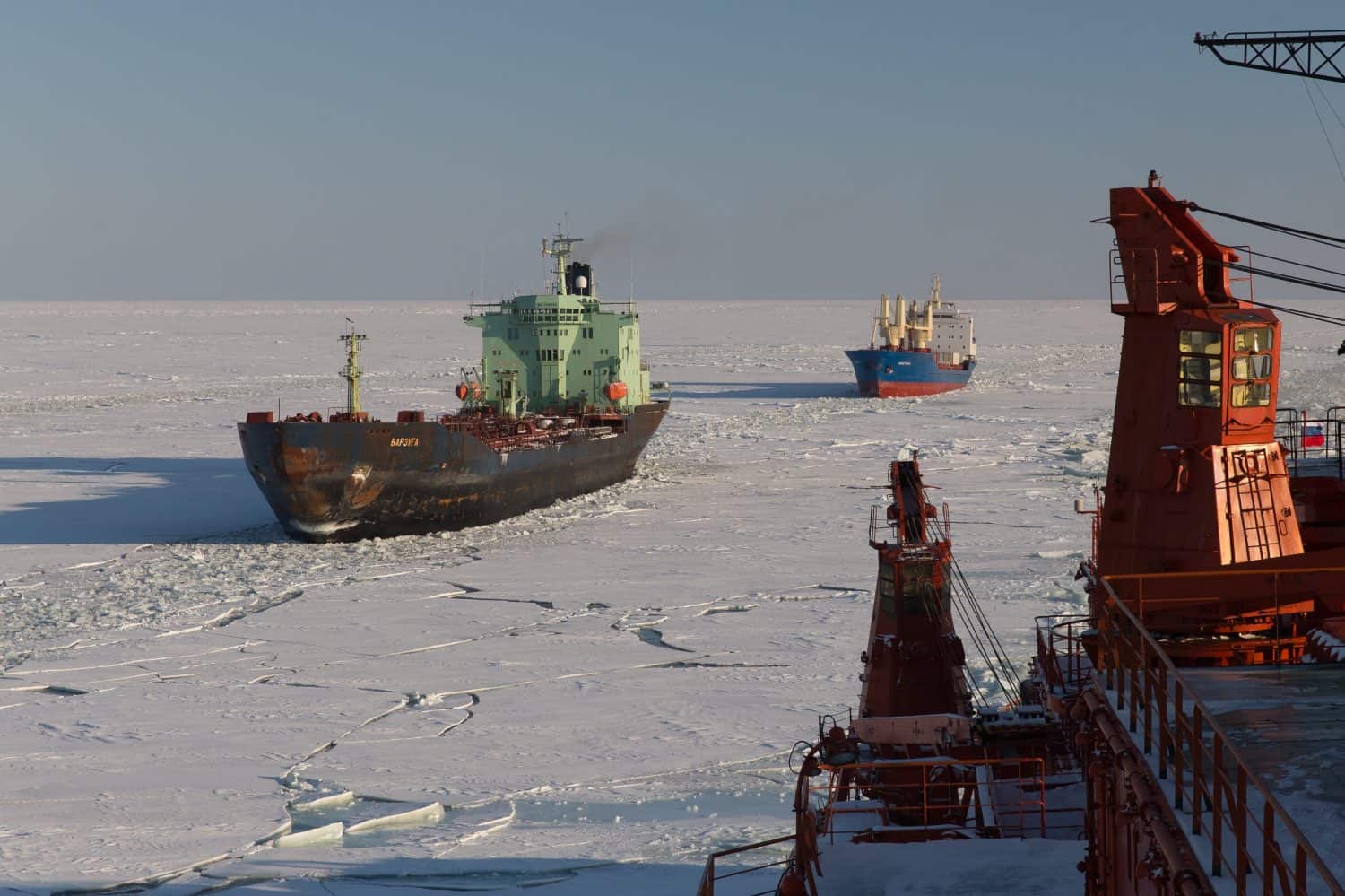 Nuclear icebreaker leads a convoy of ships in the Arctic Ocean