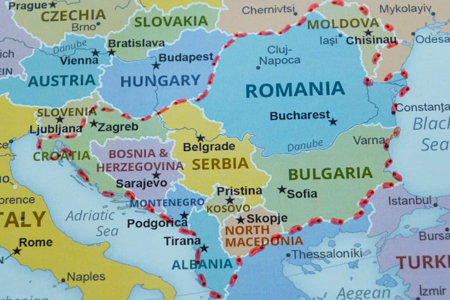 Balkan countries and region on map marked with a pen, Balkan travel route on map with red pen, travel idea, vacation and road trip concept, europe destination, top view