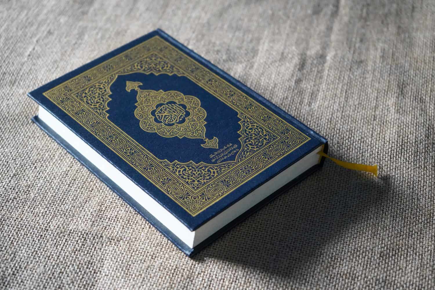 The Quran, also romanized Qur&#039;an or Koran, is central religious text of Islam, believed by Muslims to be revelation from God (Allah). Classical Arabic. Sack, blue.