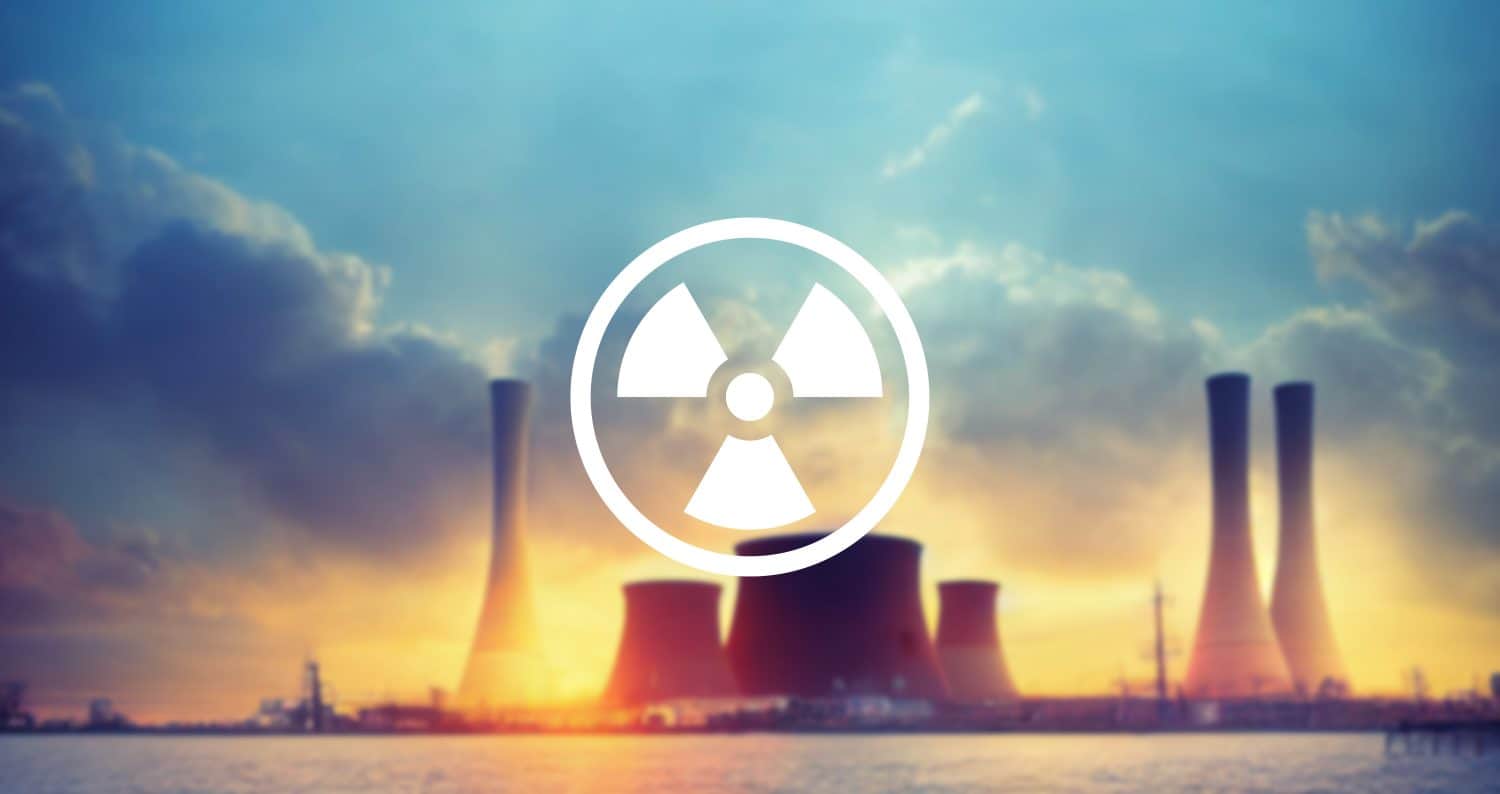 Nuclear icon and power plant background.