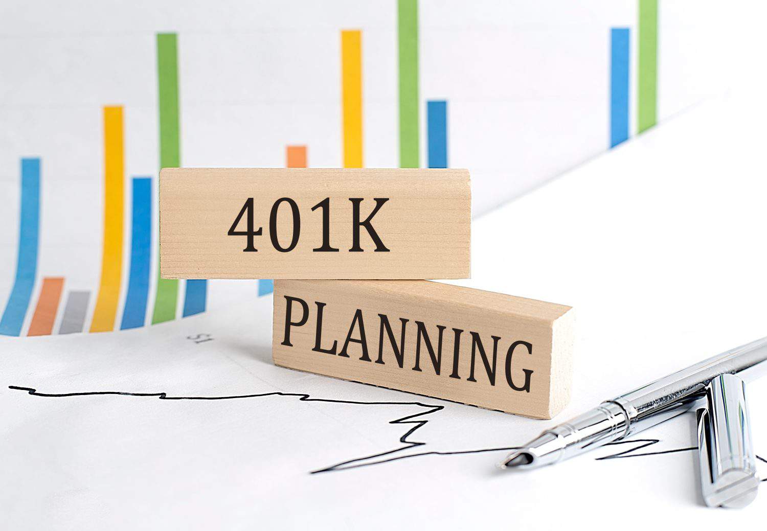 401 K PLANNING text on wooden block on chart background , business concept