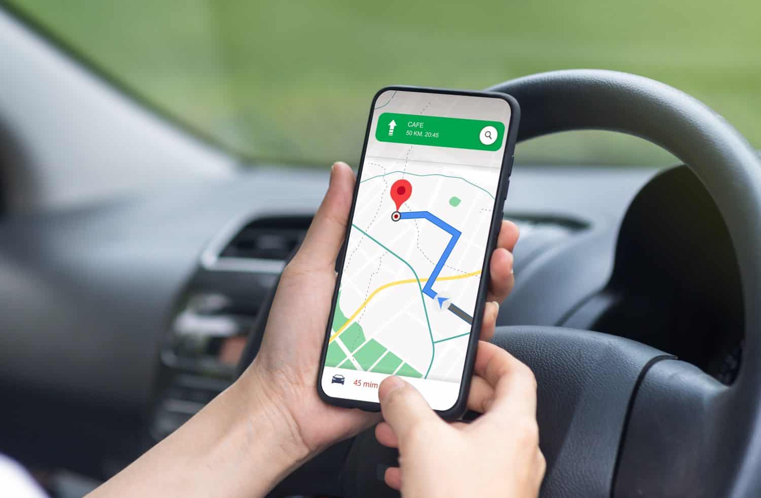 woman driving a car using a mobile phone application to search for maps route road highway Transportation concept.