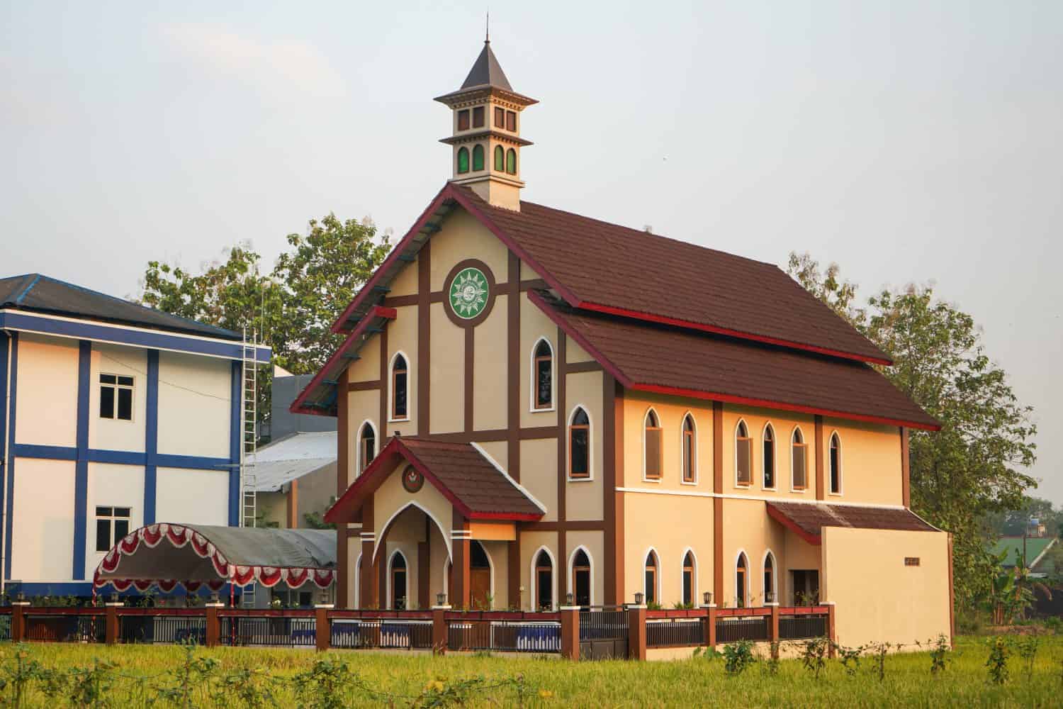 Church building in a village. A church, church building, or church house is a building used for Christian worship services and other Christian religious activities. Kudus, Central Java, Indonesia.