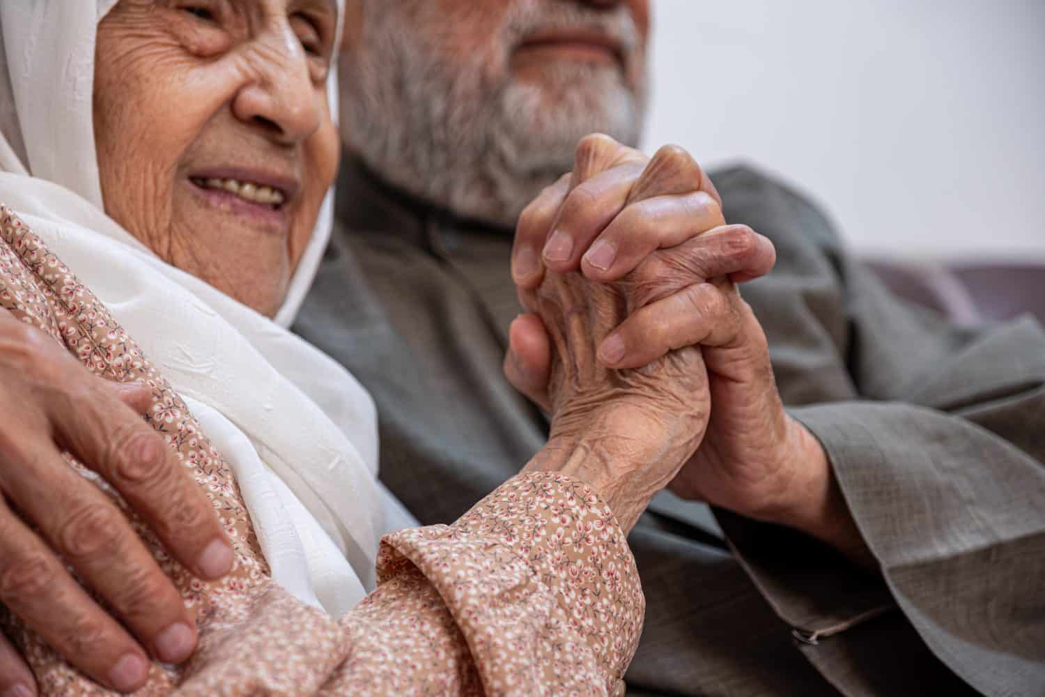 Arabic old couples love each other while holding their hands