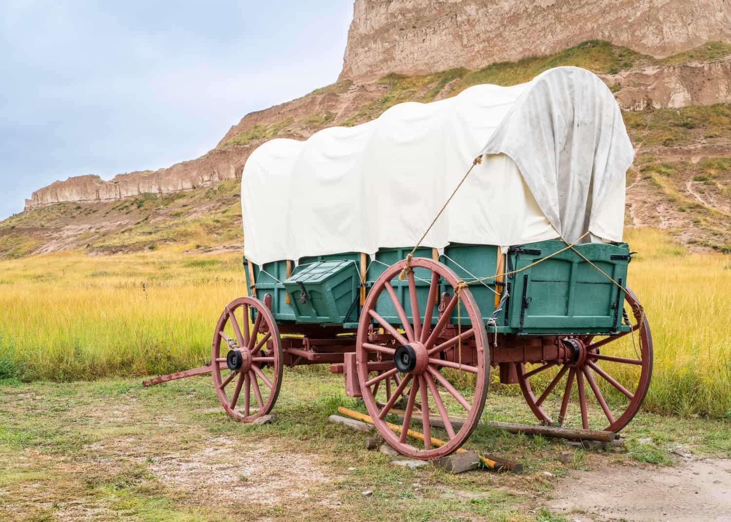 replica of pioneer covered wagon on prairie in Scotts Bluff National Monument, Nebraska